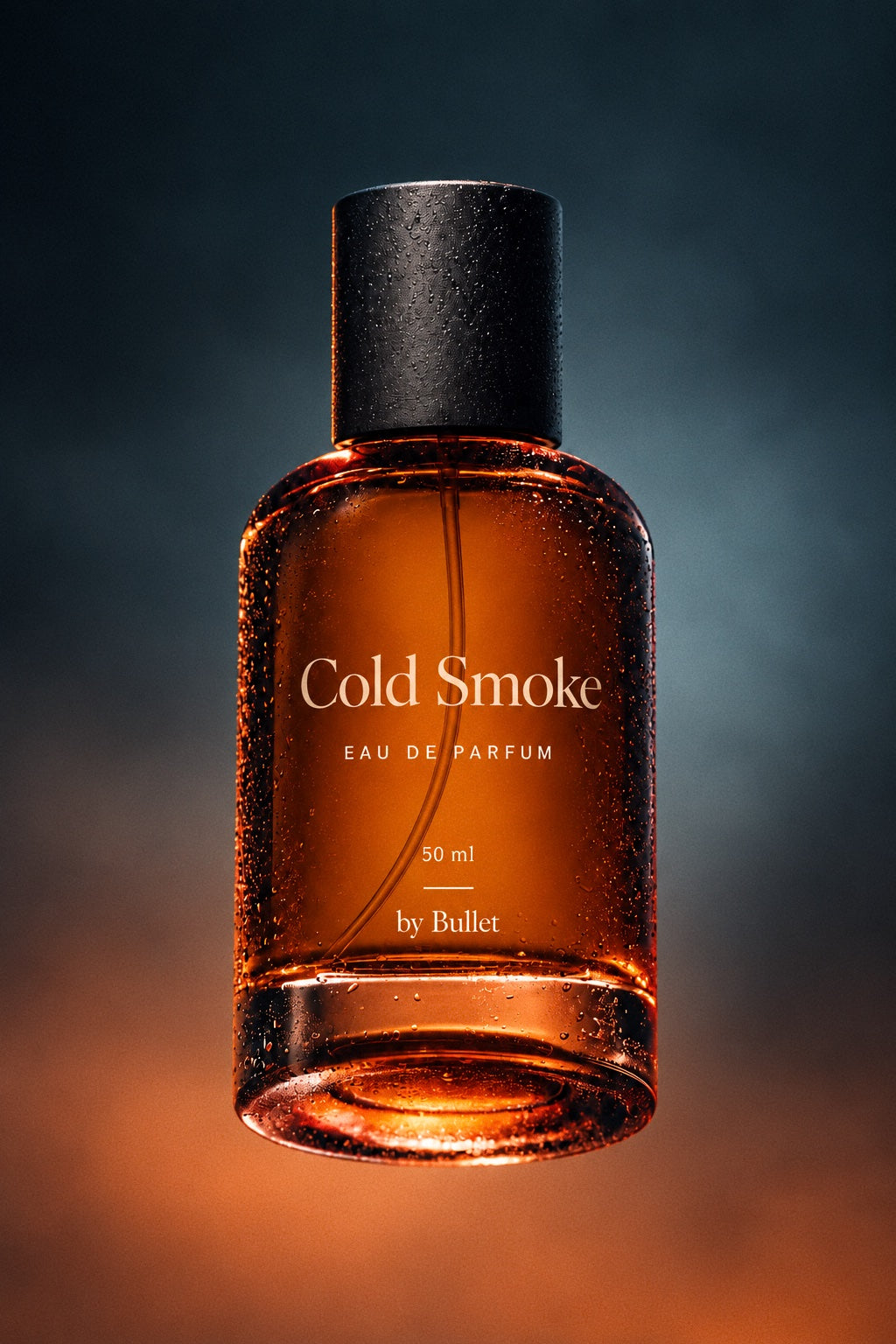 A 50 ml bottle of Cold Smoke Eau De Parfum by Bullet, featuring amber-colored liquid and a matte black cap, set against a dark smoky background with warm orange glow at the bottom.
